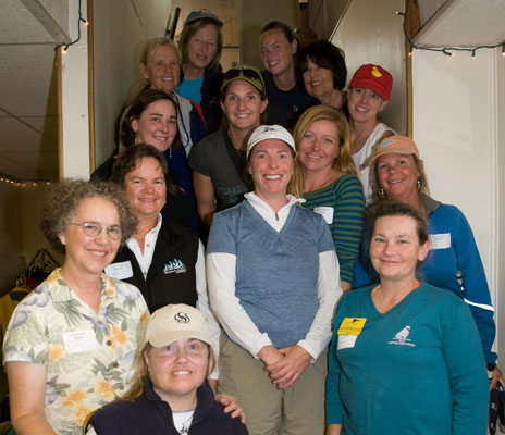 Instructors pose on the stairs